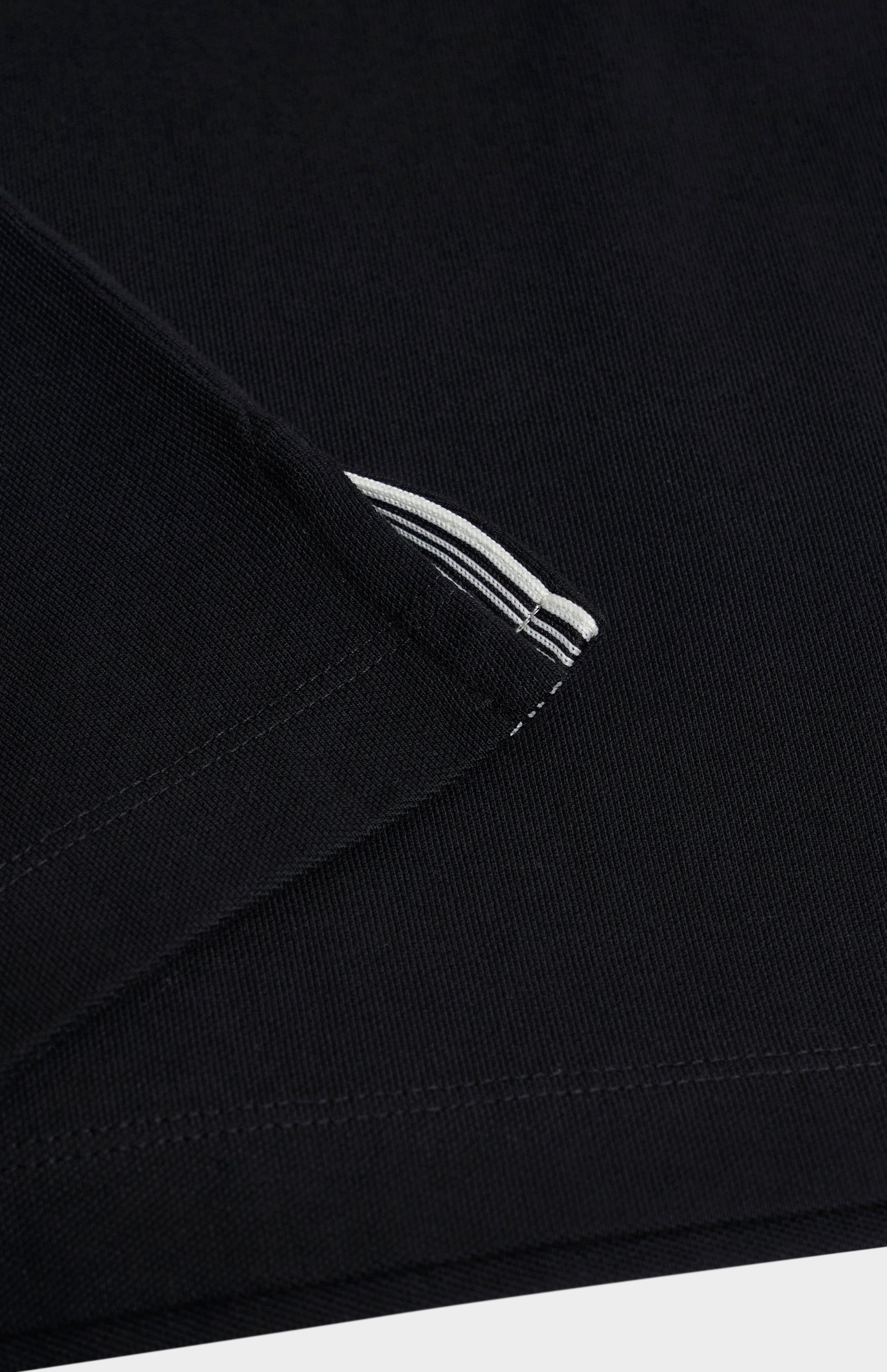 Close-up of a black fabric polo shirt