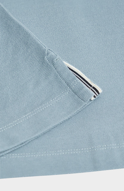 Close-up of a light blue fabric  on a white background