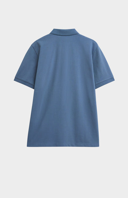 Blue polo shirt on a light gray background