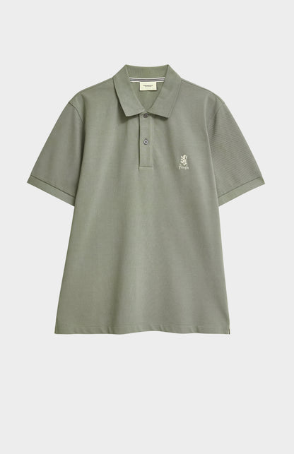 Green polo shirt with a small logo on a white background