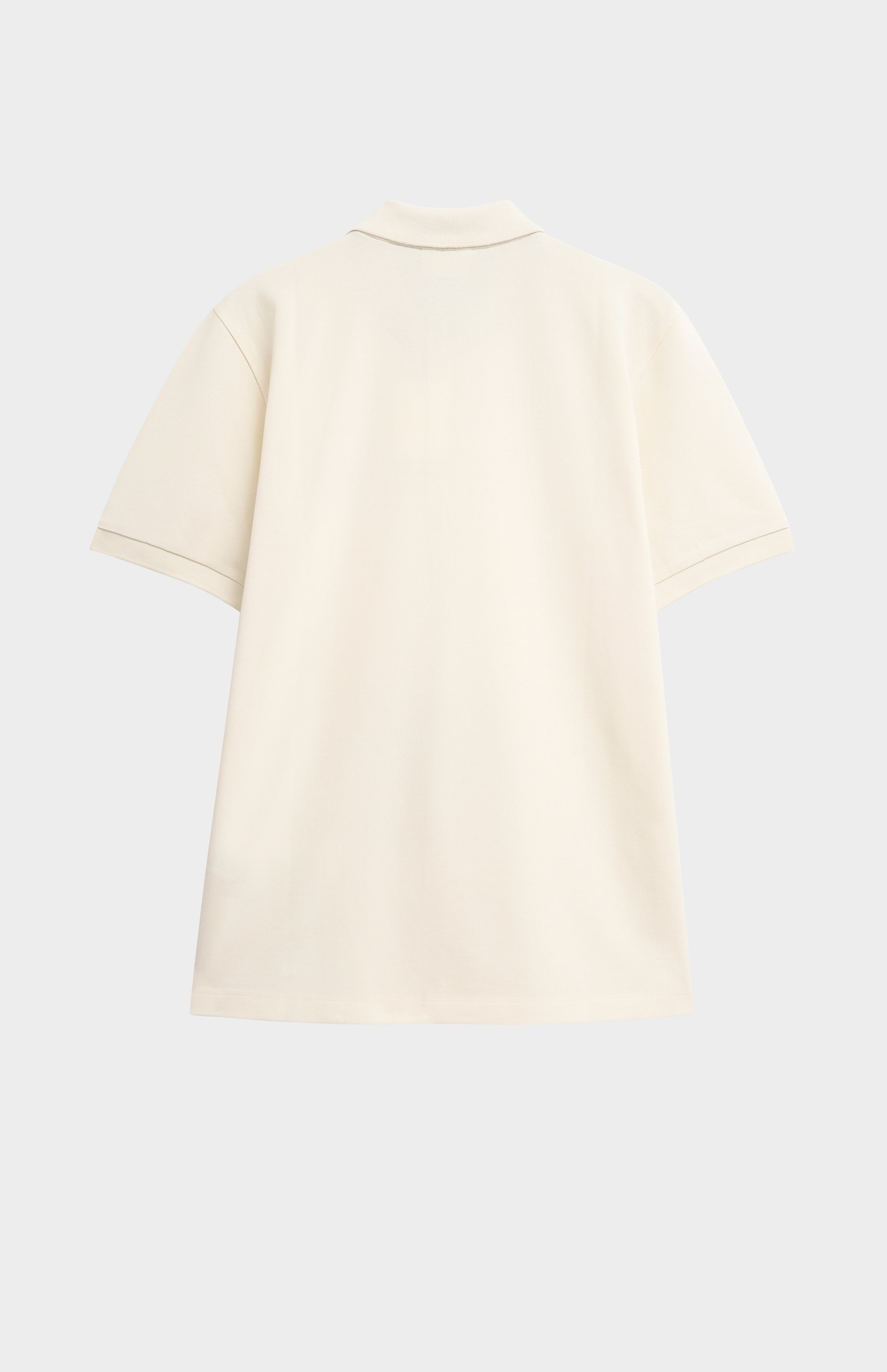 Beige polo shirt on a light gray background