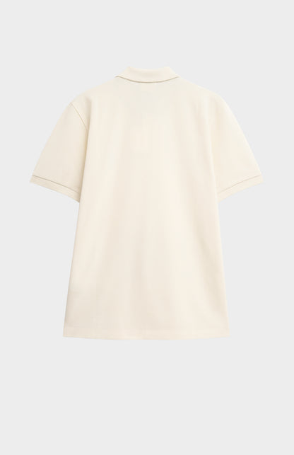 Beige polo shirt on a light gray background