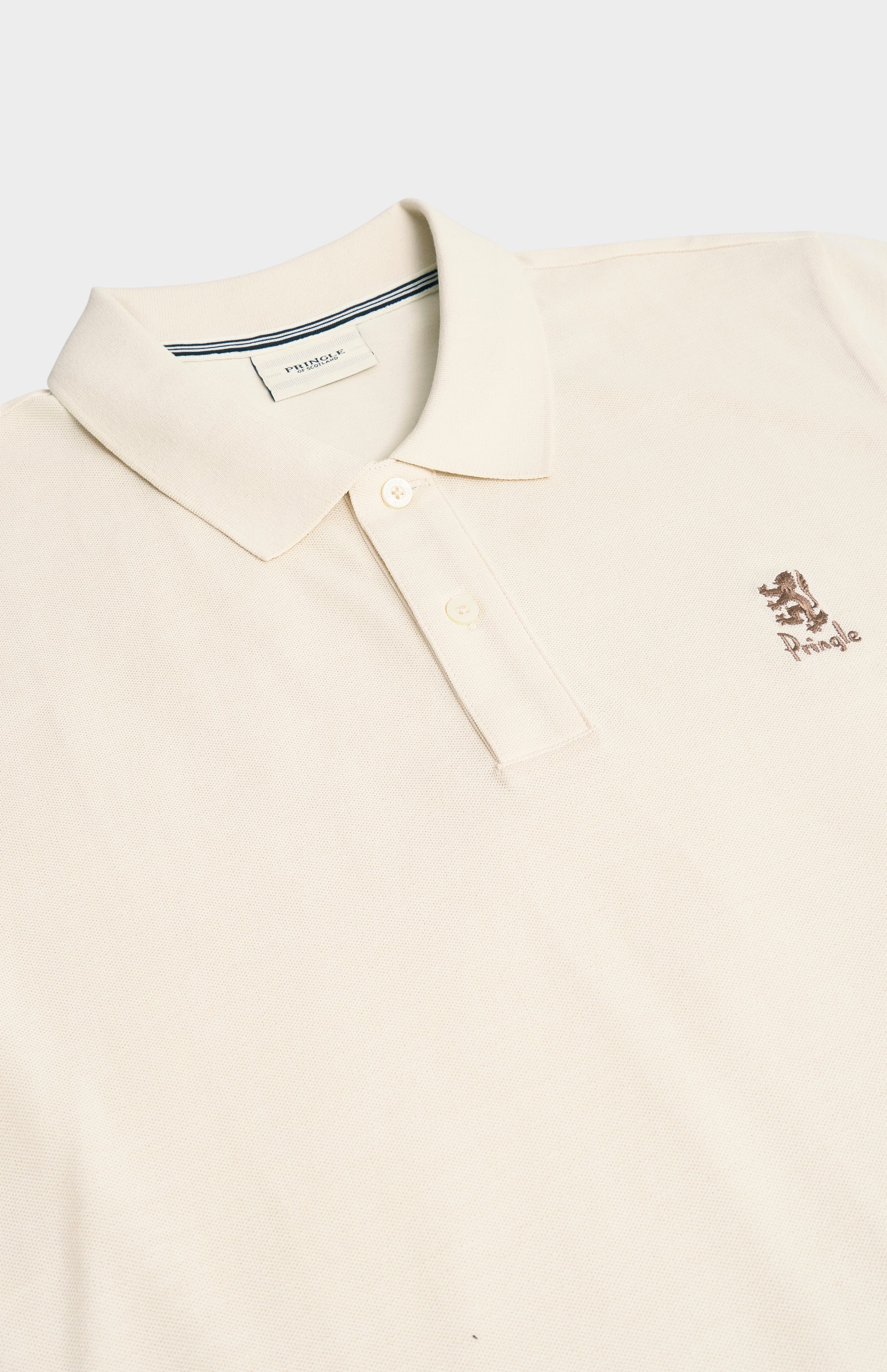 Beige polo shirt with a small logo on a white background