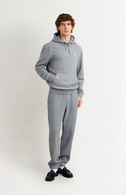 Pringle of Scotland Men's Hooded Jumper In Grey Melange on model with matching track bottoms
