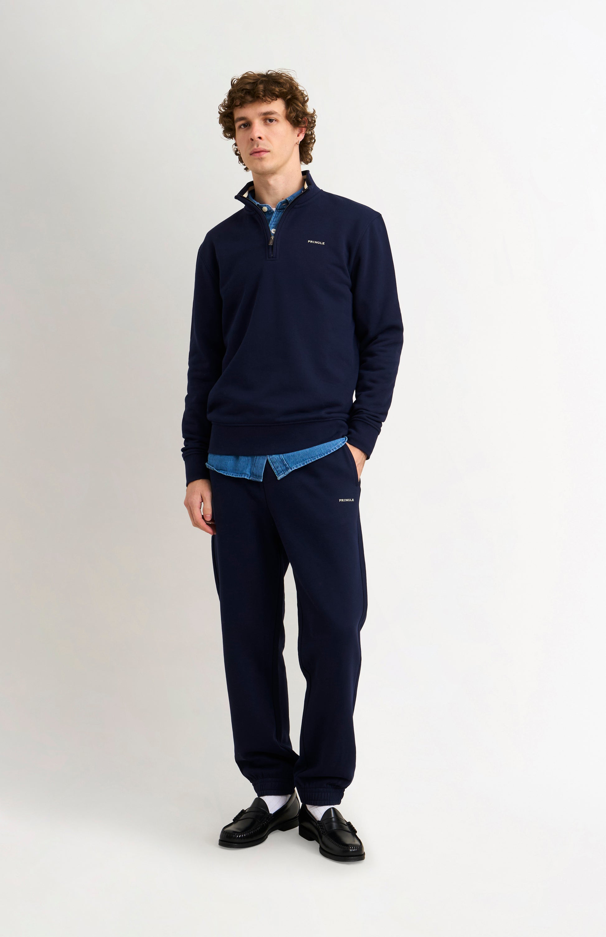 Pringle Men's Qtr Zip Track Jumper In Navy Blue on model