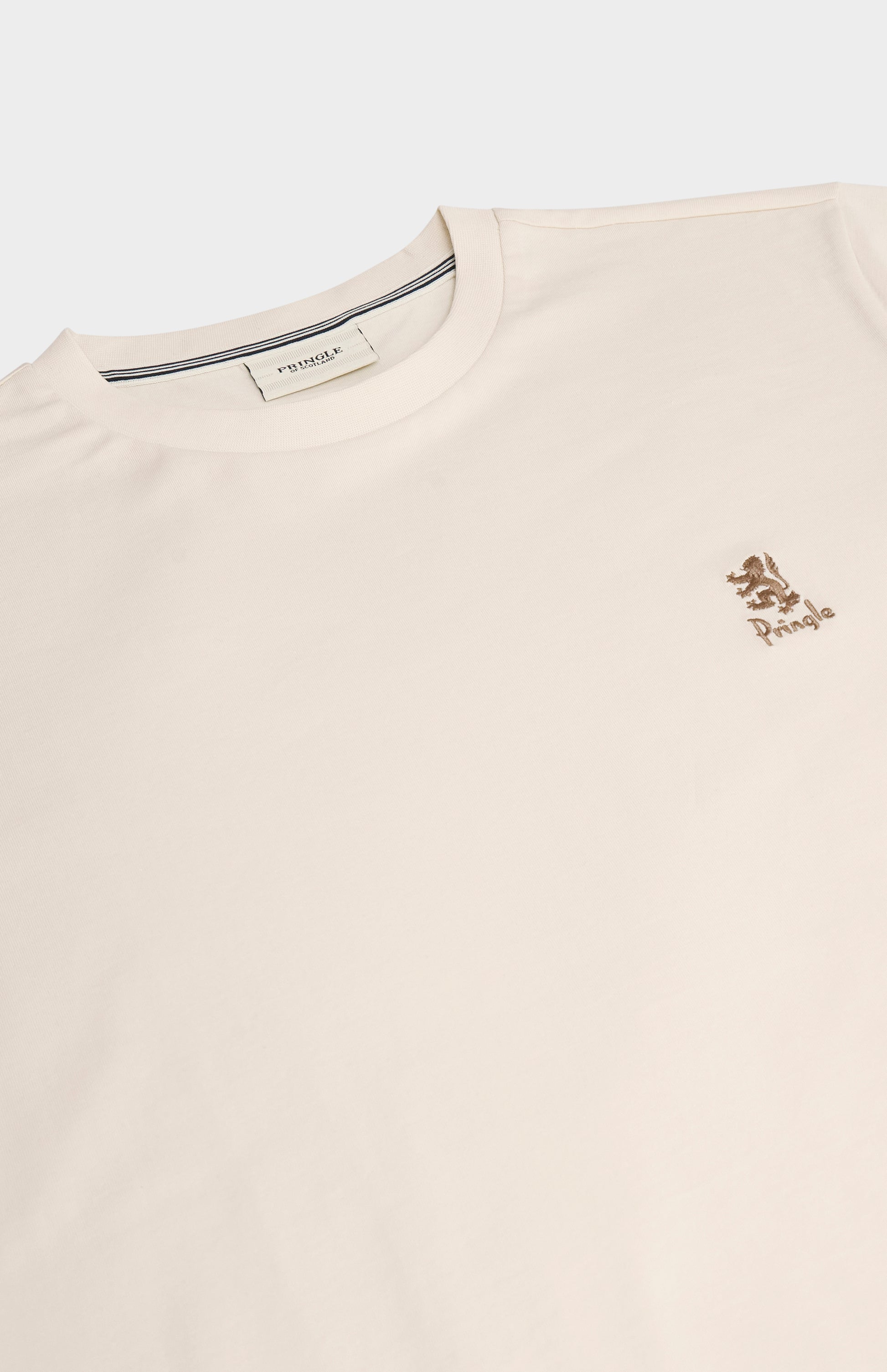 Beige t-shirt with a small logo on a white background