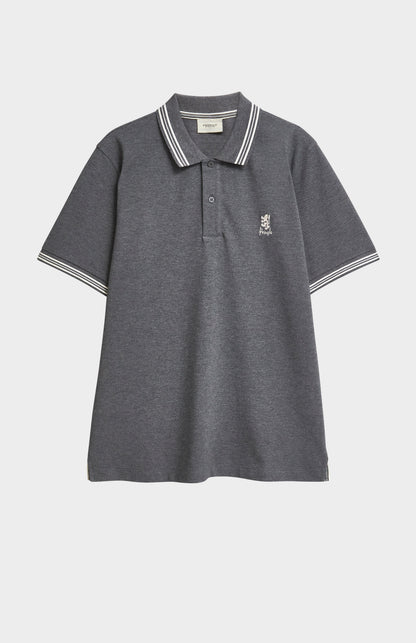 A charcoal grey polo with white tipping details and a Pringle logo on the upper side of the chest