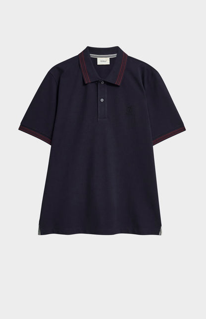 A navy polo shirt with burgundy tipping details and Pringle logo on upper side of chest