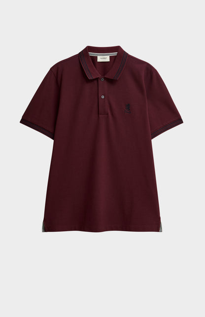 Burgundy polo with black tipping and a small Pringle logo on top side of chest