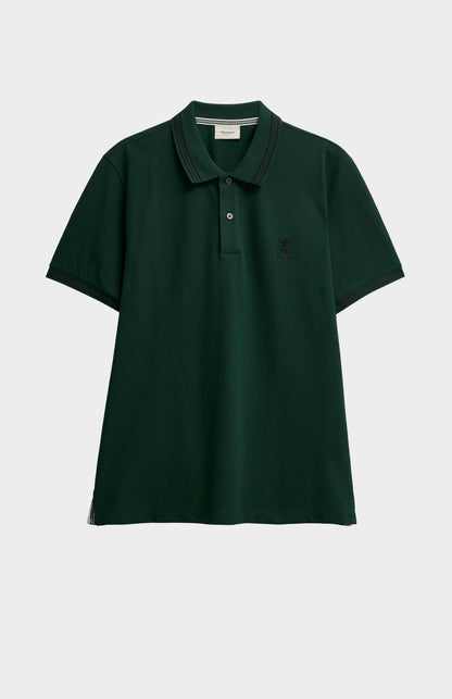 A forest green polo with tipping details and small Pringle logo on upper side of chest