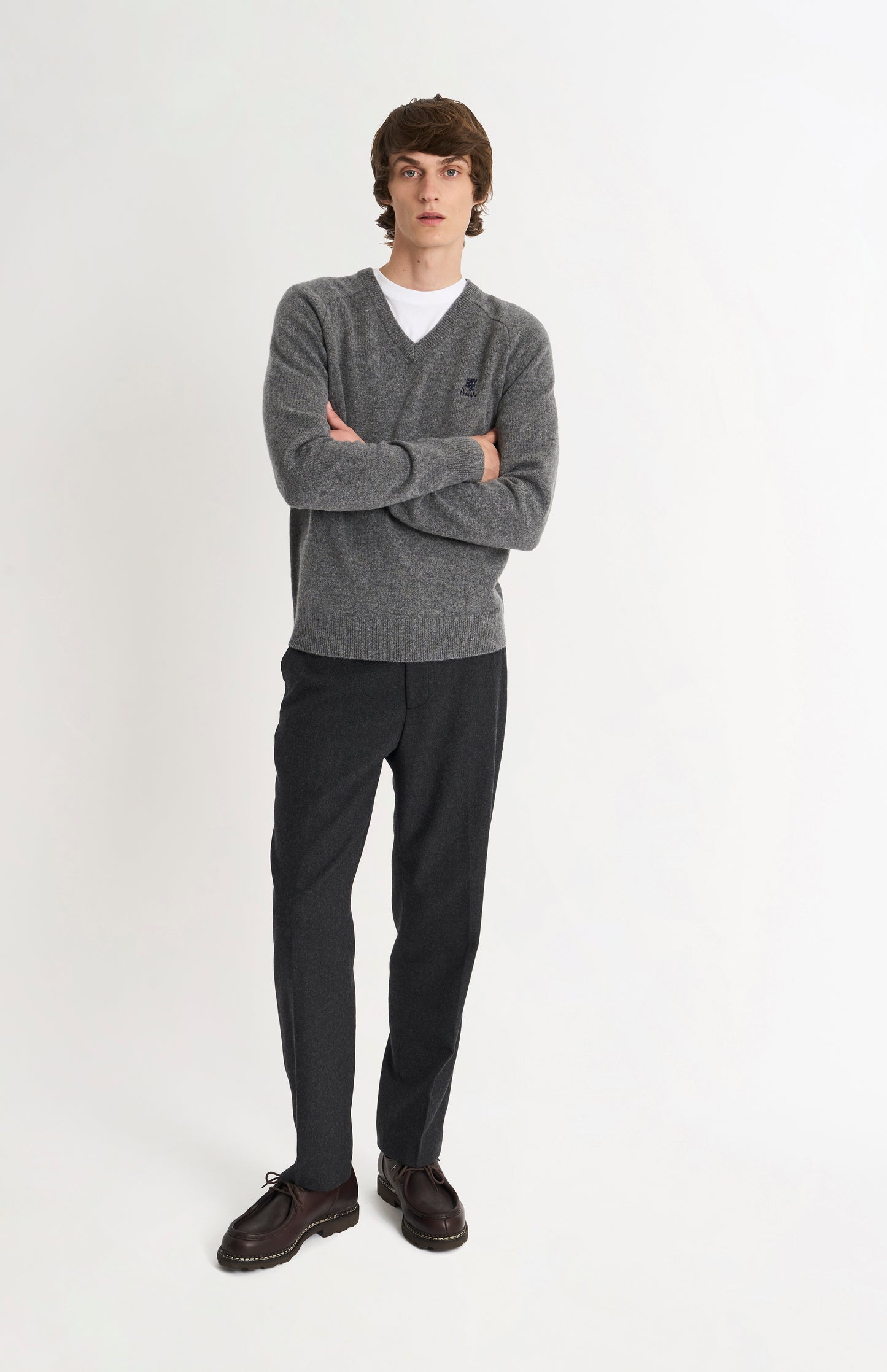 Pringle of Scotland Men’s Lambswool V Neck Jumper In Grey Melange on standing model