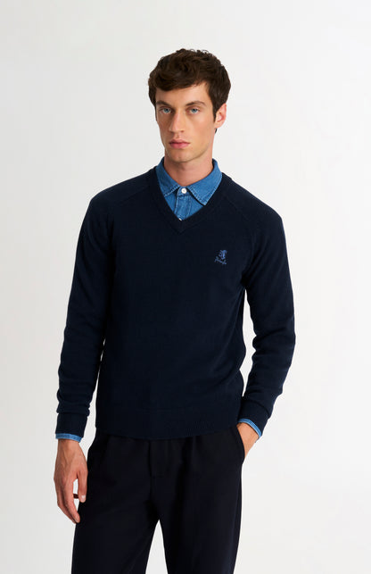 Pringle of Scotland Men’s Lambswool V Neck Jumper In Navy Blue on model