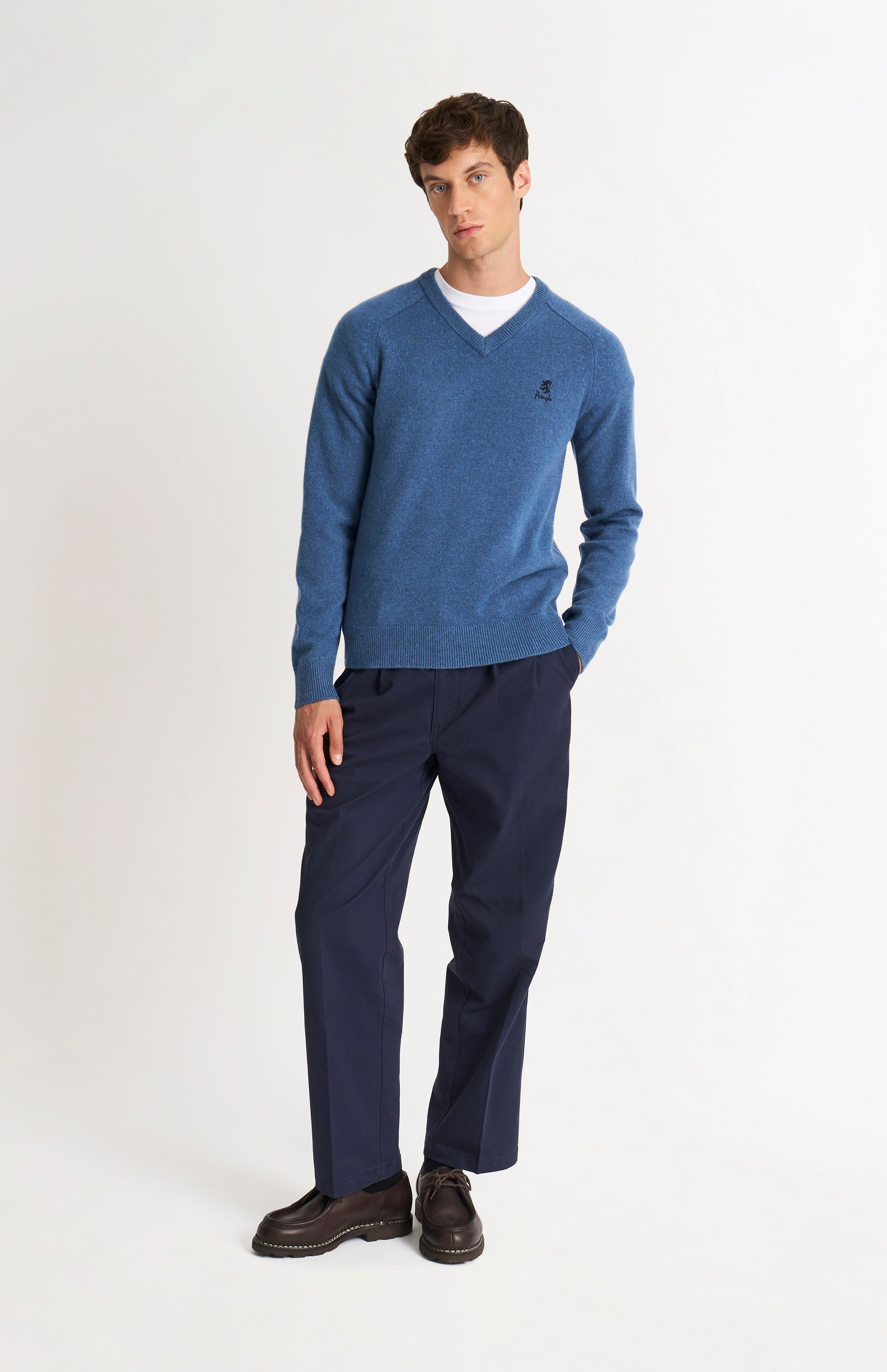 Pringle of Scotland Men’s Lambswool V Neck Jumper In Bering Sea Blue on standing model