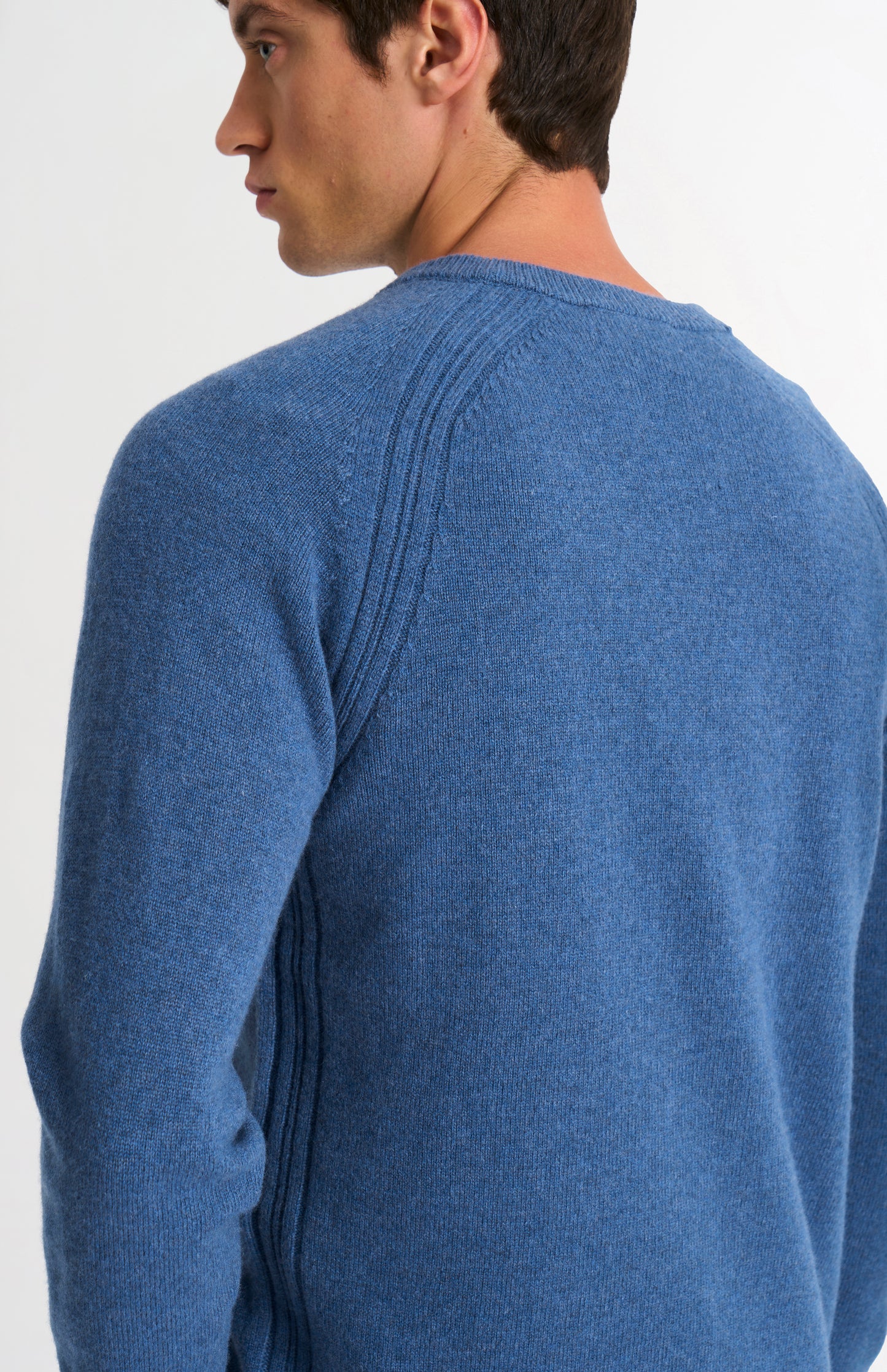 Pringle of Scotland Men’s Lambswool V Neck Jumper In Bering Sea Blue showing back neck detaiol