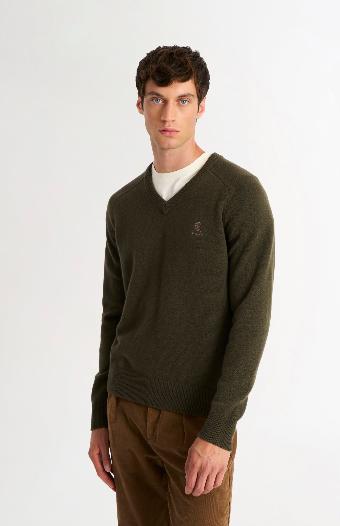 Pringle of Scotland Men’s Lambswool V Neck Jumper In Dark Olive on model