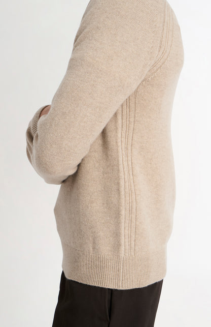 Pringle of Scotland Men’s Lambswool V Neck Jumper In Oatmeal side view on model