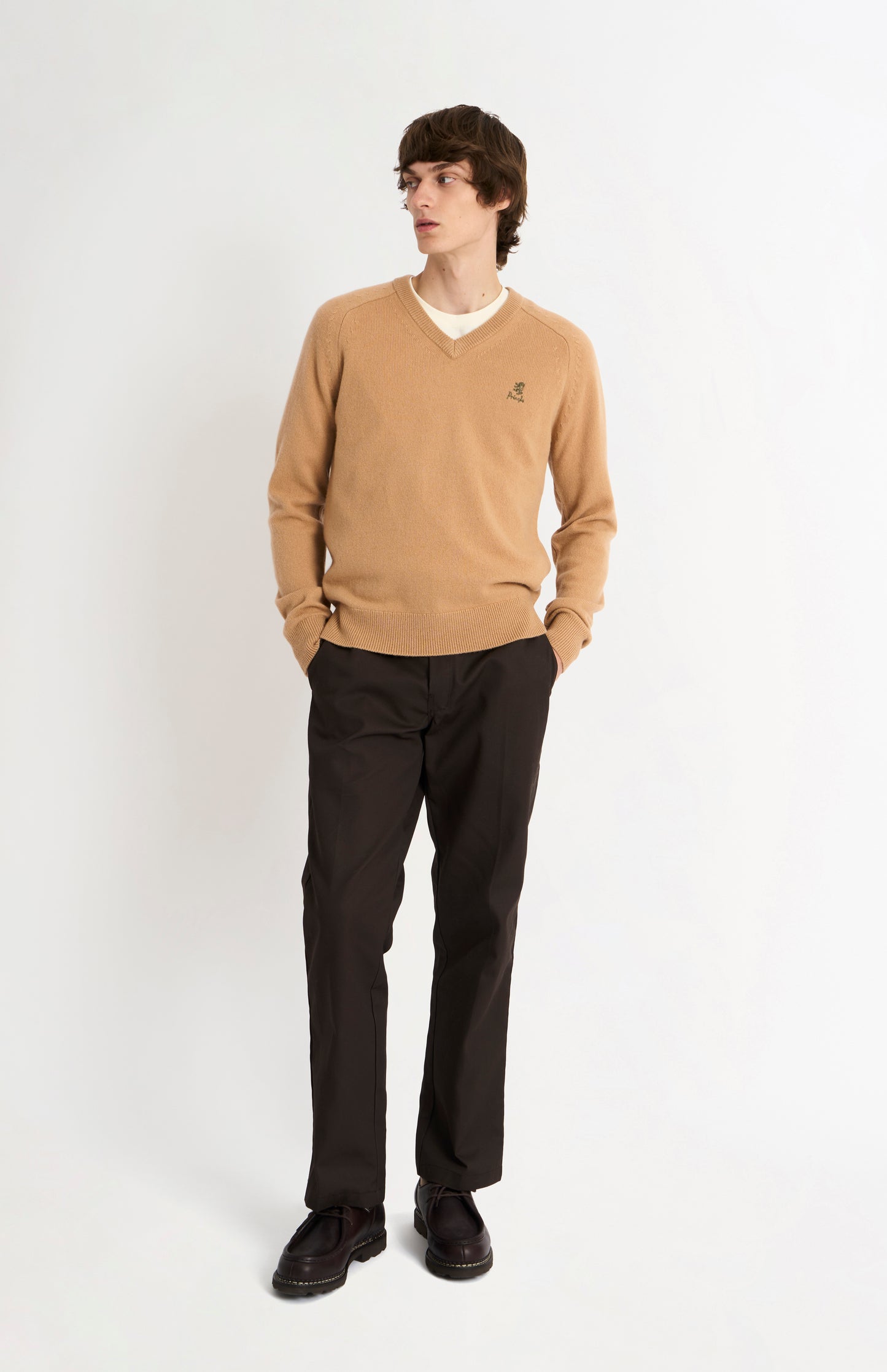 Pringle of Scotland Men’s Lambswool V Neck Jumper In Camel on standing model