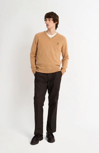 Pringle of Scotland Men’s Lambswool V Neck Jumper In Camel on standing model