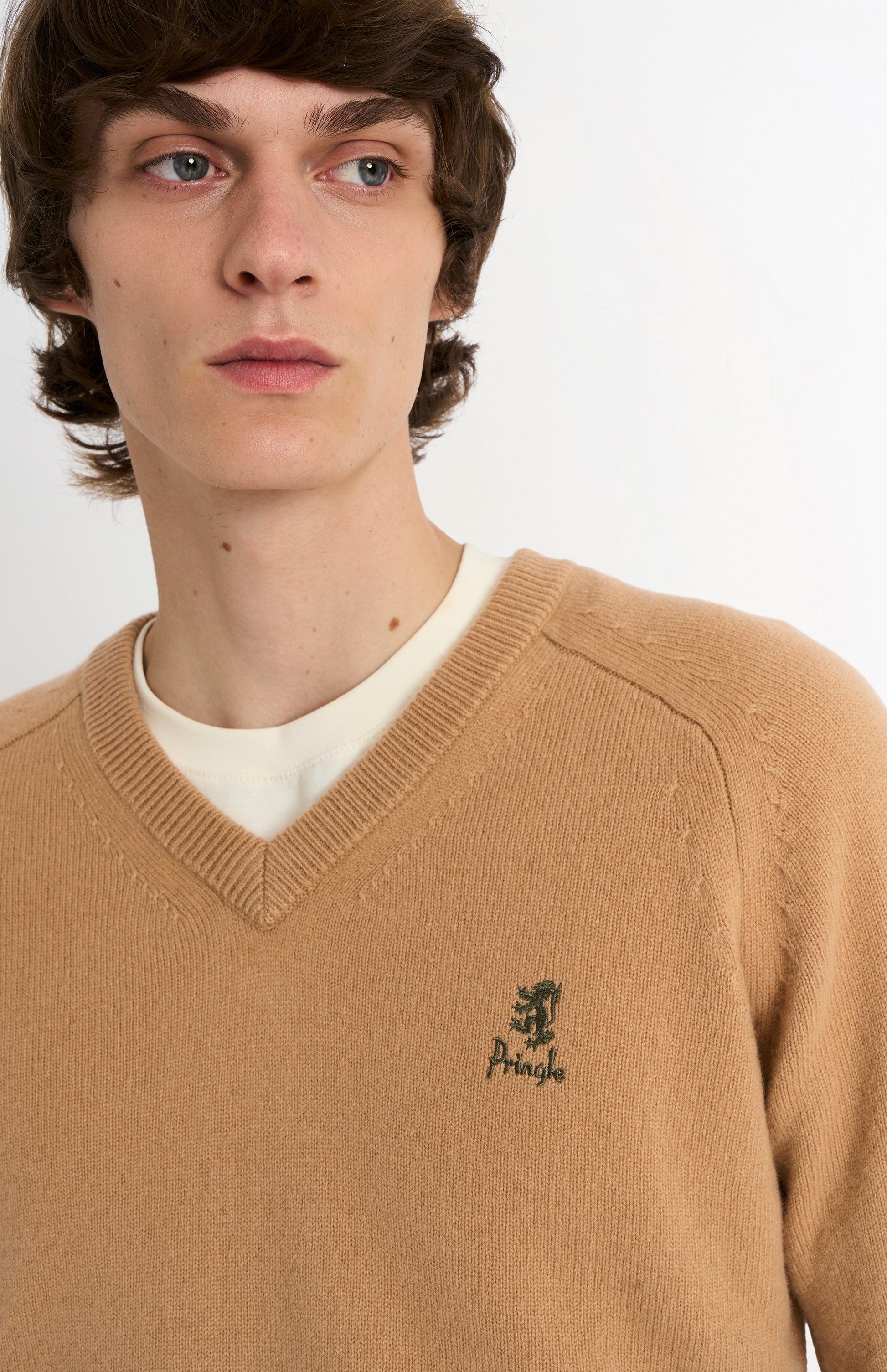 Pringle of Scotland Men’s Lambswool V Neck Jumper In Camel showing embroidered logo