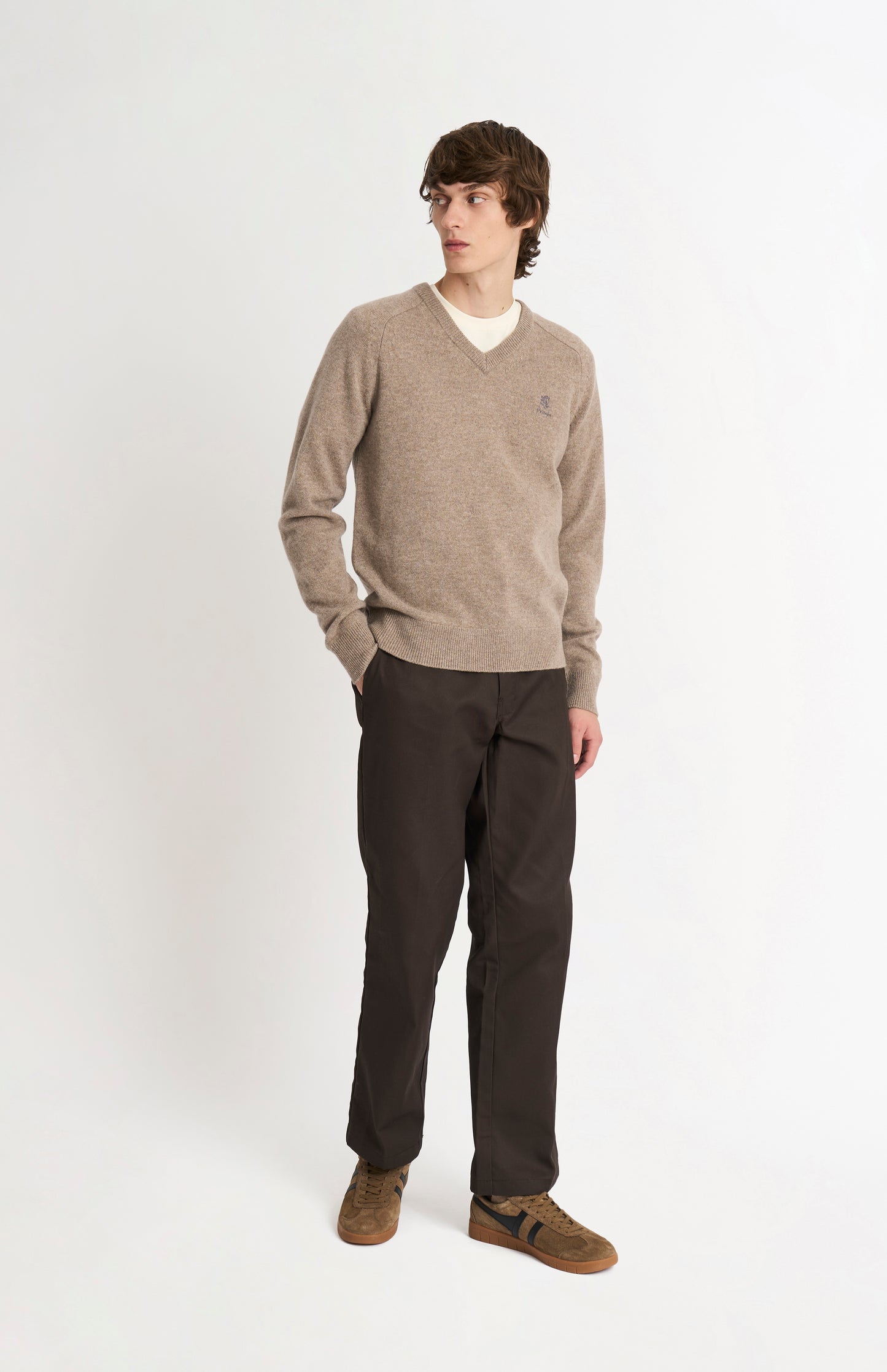 Pringle of Scotland Men’s Lambswool V Neck Jumper In Mushroom on standing model
