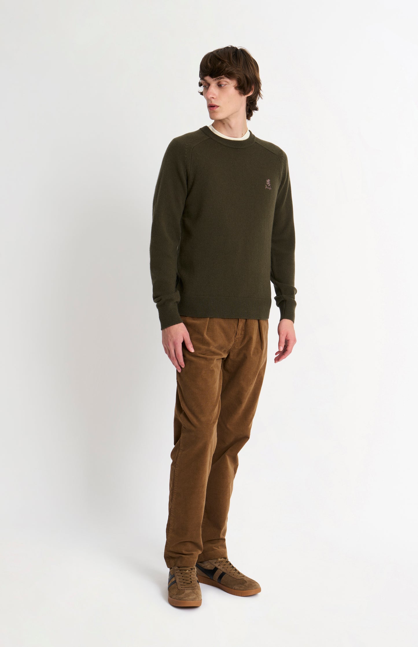 Pringle of Scotland Men’s Lambswool Crew Neck Jumper In Dark Olive on standing model