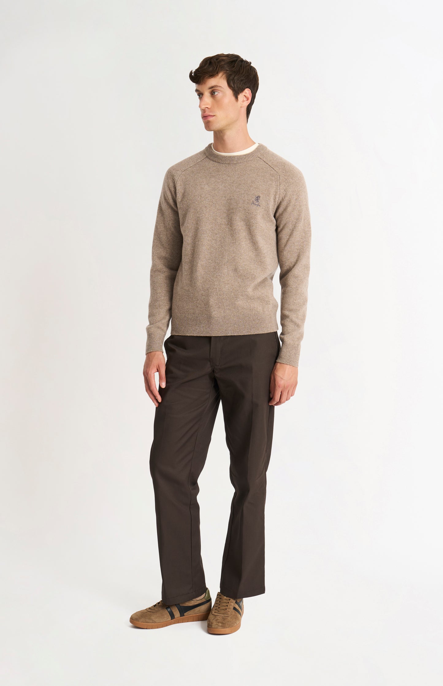 Pringle of Scotland Men’s Lambswool Crew Neck Jumper In Mushroom on standing model