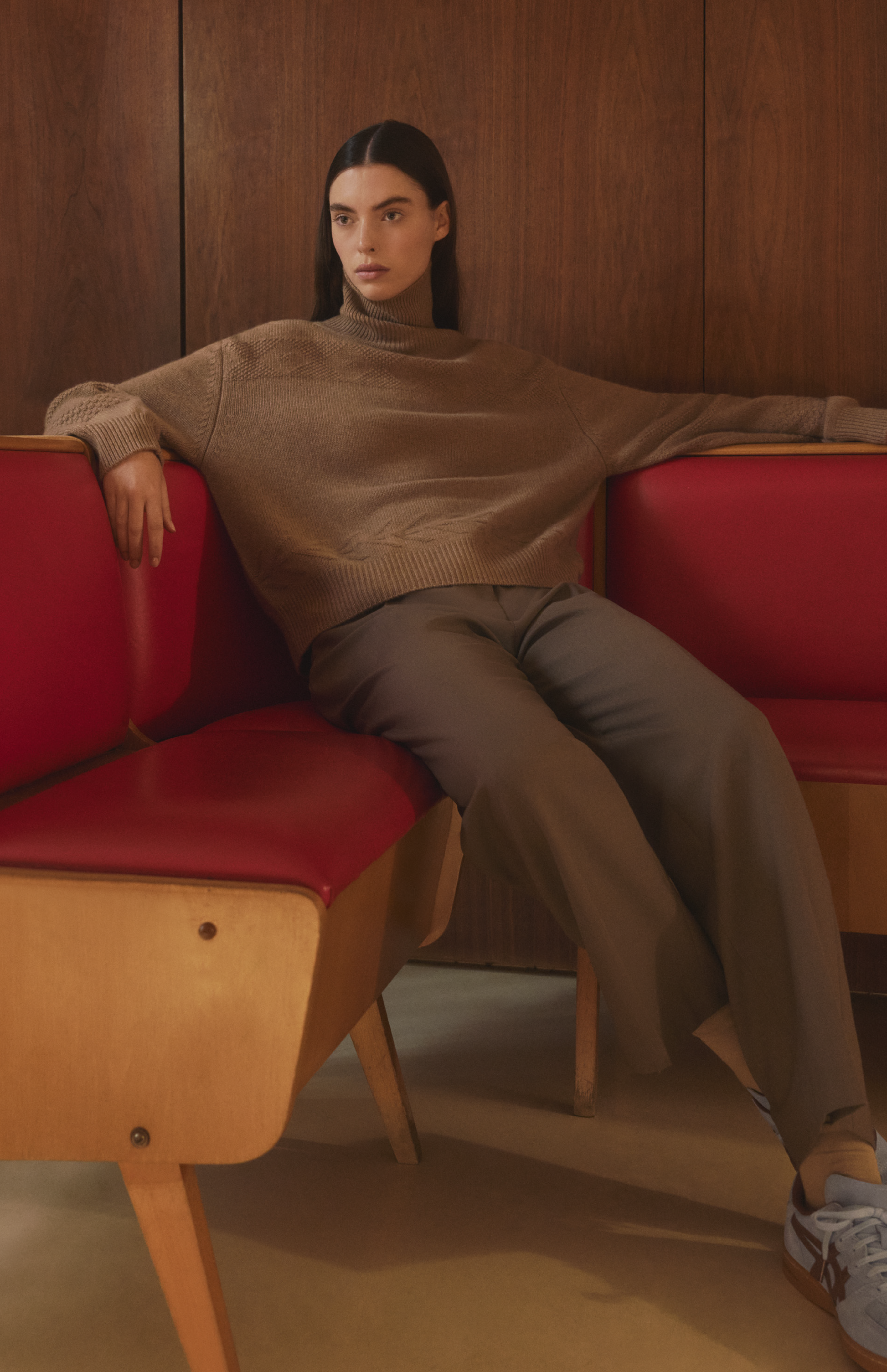 Woman wearing a Pringle of Scotland high neck cashmere jumper