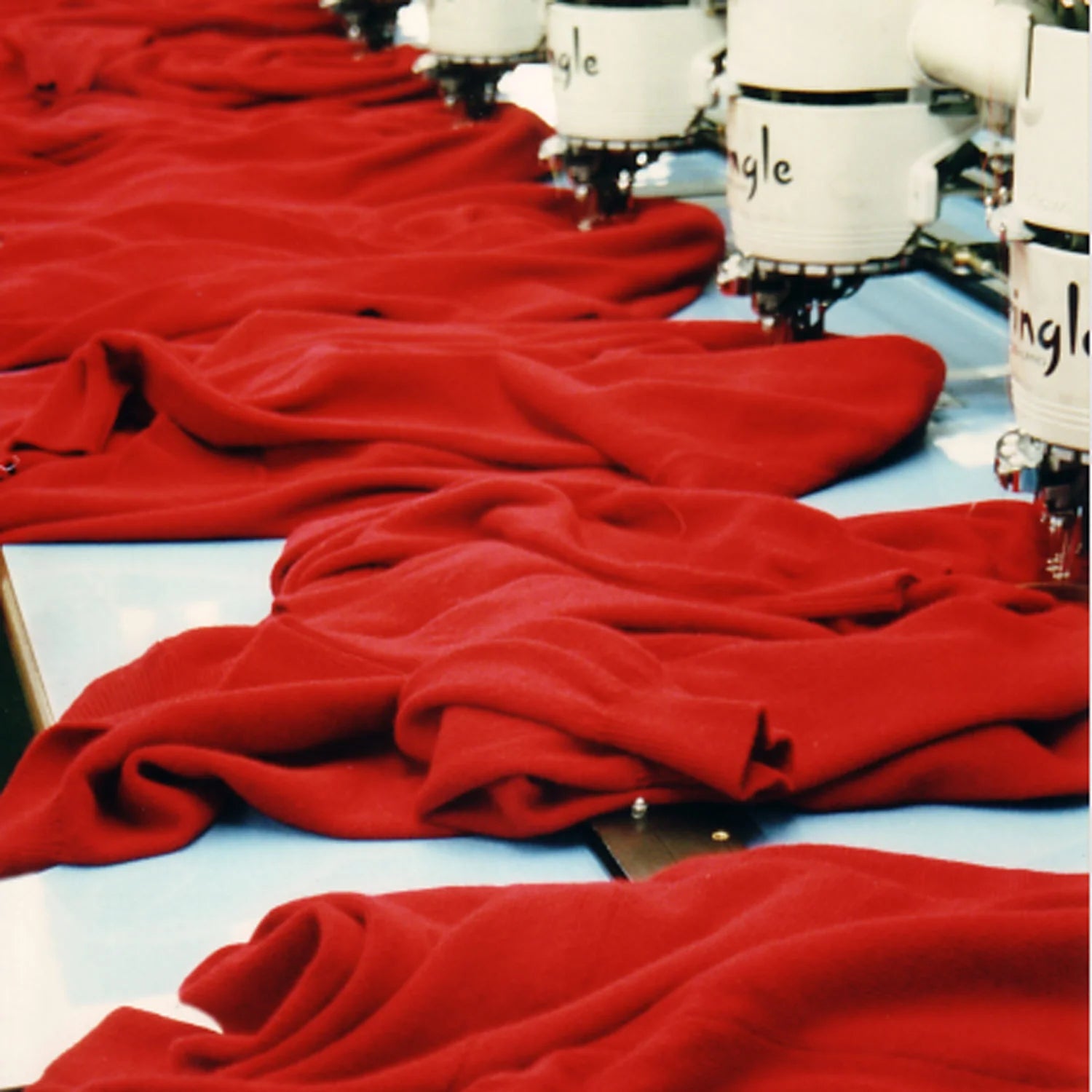 Pringle of Scotland archive image of jumpers being embroidered