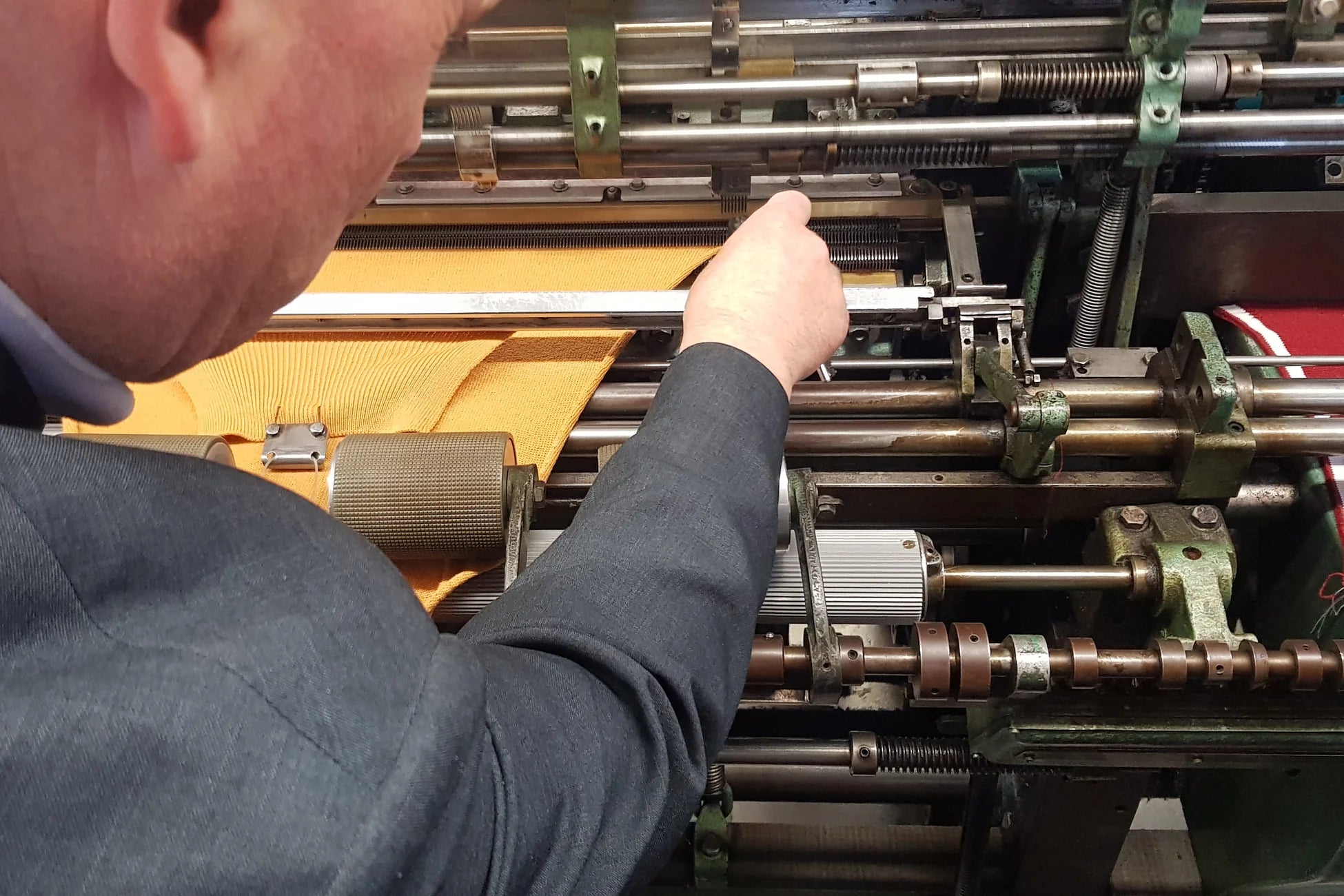 Pringle of Scotland close up of worker and knitting machine
