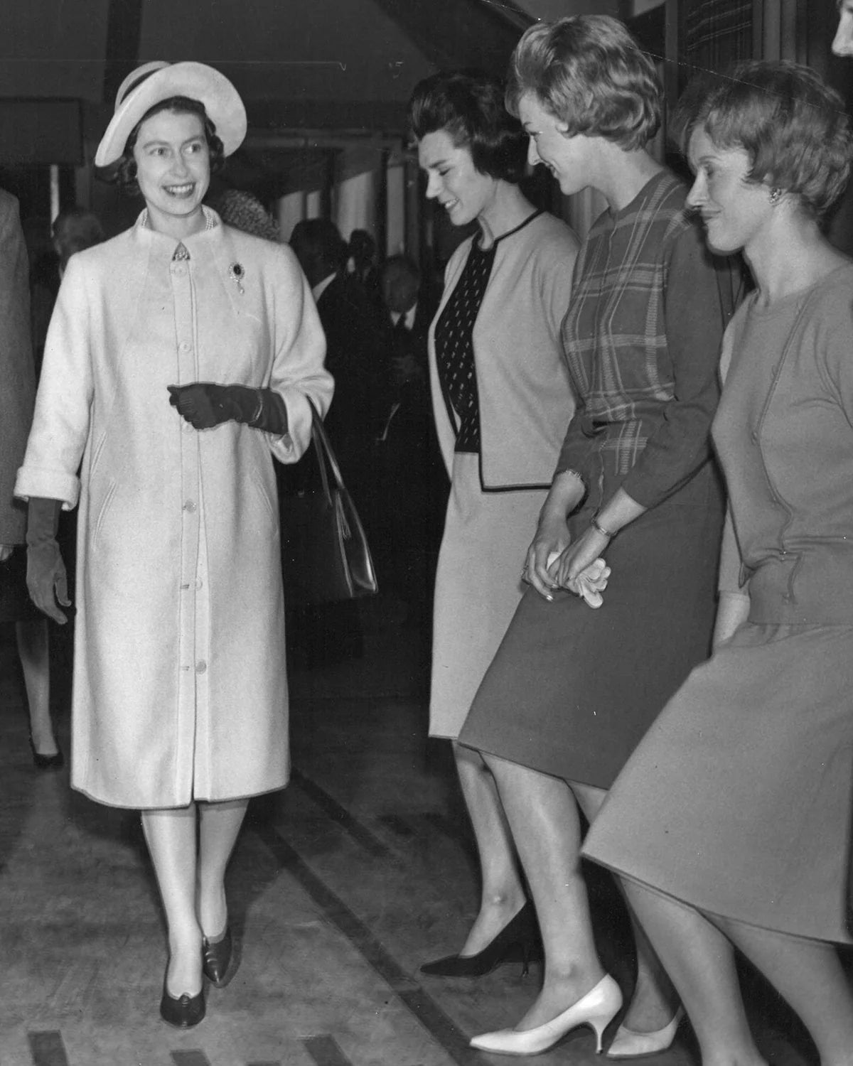 Queen Elizabeth II meeting Pringle of Scotland staff