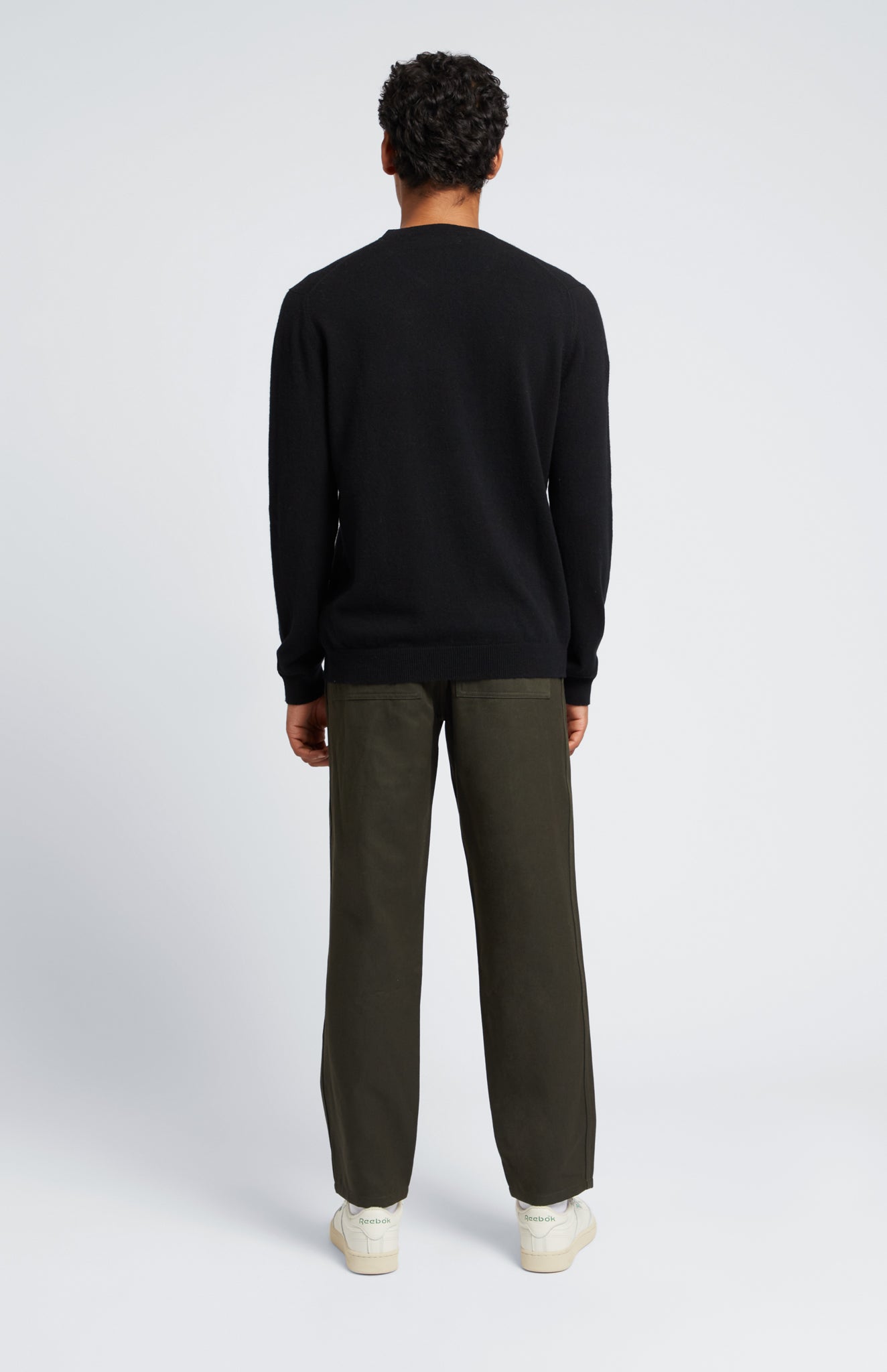 Men's Scottish Cashmere Round Neck Jumper In Black on model rear shot - Pringle of Scotland