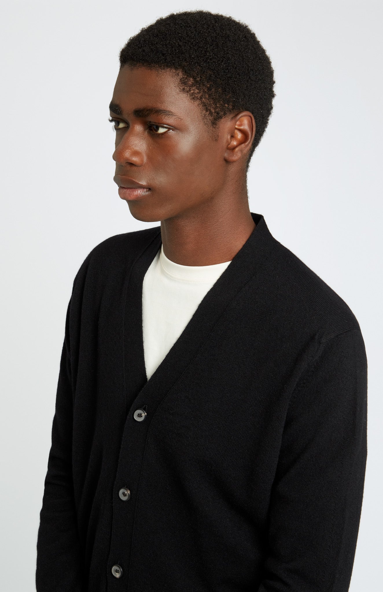 Pringle of Scotland Men's Cashmere Cardigan in Black. Front Cropped Image on model